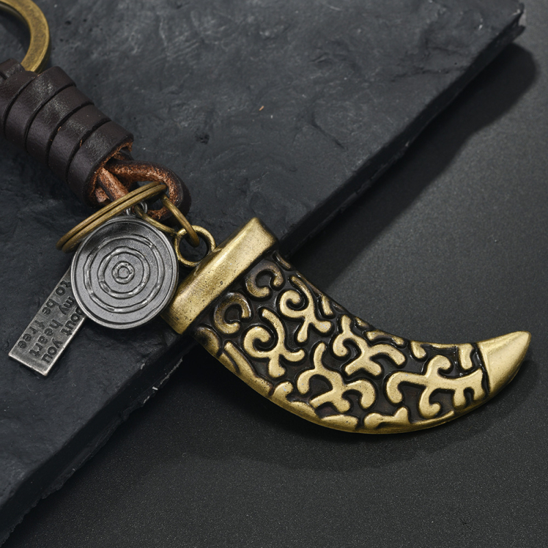 Határokon átnyúló türkiz kulcstartó népszerű kreatív férfi és női ajándékok ötvözet toll szarv retro szőtt marhabőr medál