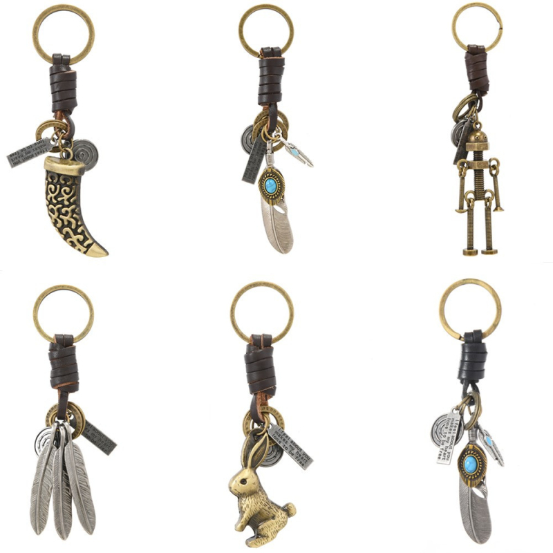 Határokon átnyúló türkiz kulcstartó népszerű kreatív férfi és női ajándékok ötvözet toll szarv retro szőtt marhabőr medál