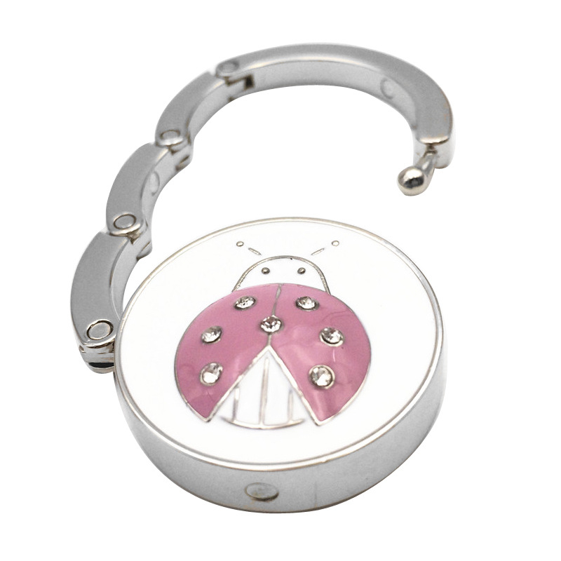 raktáron Összecsukható krémszínű bogárkampó kreatív szkarabeusz táskaakasztó bogár összecsukható hordozható kettős célú női táskaakasztó