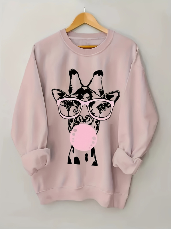 Hosszú ujjú, kerek nyakú, lezser pulóver, zsiráfmintával