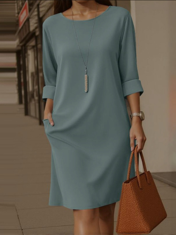 2025-ös új, európai és amerikai, határokon átnyúló, elegáns, kerek nyakú, sokoldalú, egyszínű, oldalsó zsebes, középhosszú ujjú ruha