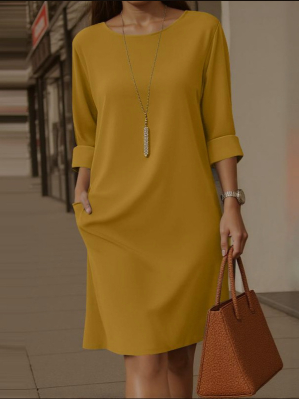 2025-ös új, európai és amerikai, határokon átnyúló, elegáns, kerek nyakú, sokoldalú, egyszínű, oldalsó zsebes, középhosszú ujjú ruha