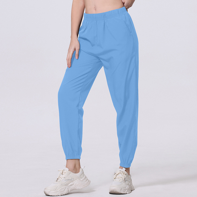 Női nyári egyszínű, egyszerű, zsebes, hosszú nadrág, lezser, sokoldalú, sportosan rövidített jogger nadrág