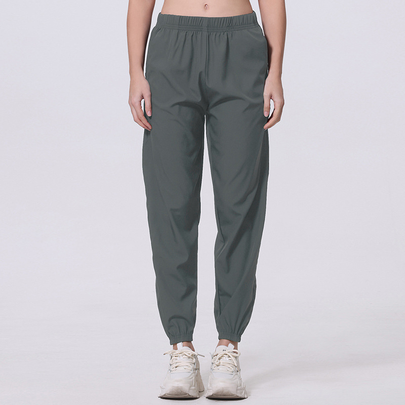 Női nyári egyszínű, egyszerű, zsebes, hosszú nadrág, lezser, sokoldalú, sportosan rövidített jogger nadrág