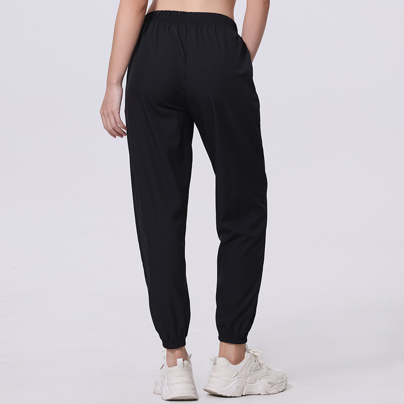 Női nyári egyszínű, egyszerű, zsebes, hosszú nadrág, lezser, sokoldalú, sportosan rövidített jogger nadrág