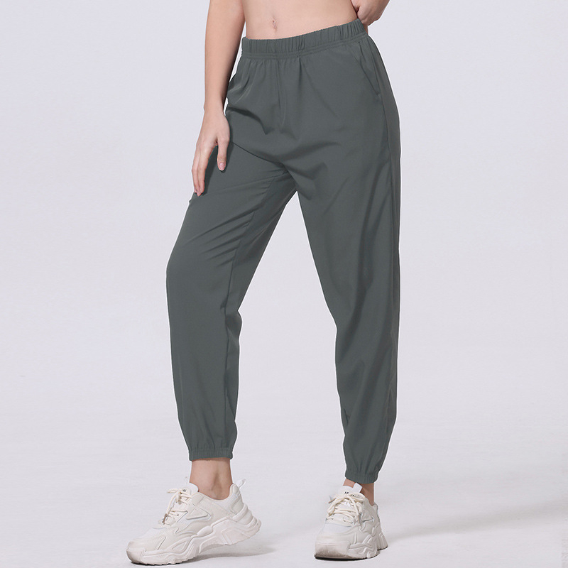 Női nyári egyszínű, egyszerű, zsebes, hosszú nadrág, lezser, sokoldalú, sportosan rövidített jogger nadrág