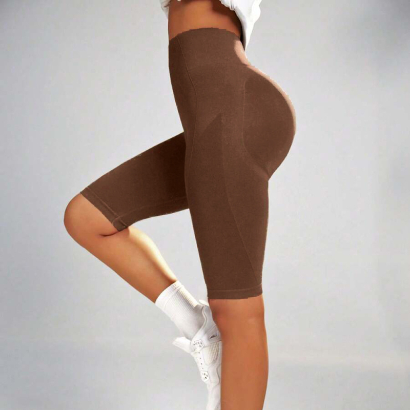 Moteriškos jogos kelnės su persikų spalvos klubų lavinimo, klubų pakėlimo, aukštu juosmeniu, pilvo raumenims skirtomis, elastingomis bėgimo treniruotėmis, greitai džiūstančiomis, aptemptomis sportinėmis kelnėmis.