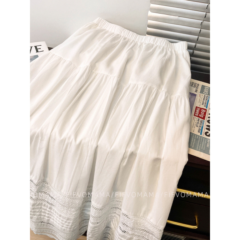 Francia fehér szoknya nőknek 2025 tavaszi és nyári új dizájn kivágott hímzett csipke középhosszú A-vonalú szoknya