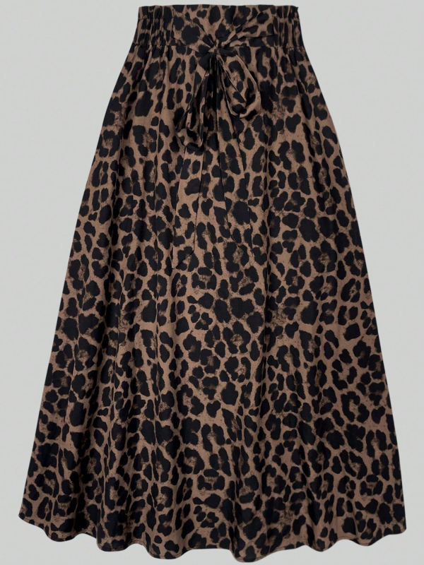 Külkereskedelmi raktáron lévő női fekete kerek nyakú, gombos, díszes hosszú ujjú póló, varrással, leopárdmintás ruha, külkereskedelem