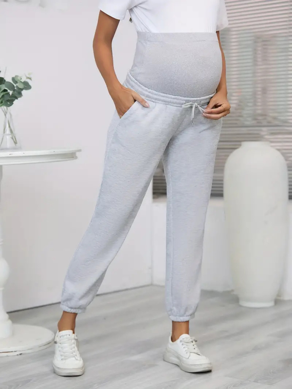 Sandėlyje esančios tarpvalstybinės tiekimos, elastingo juosmens, nėščiosioms skirtos vienspalvės kelnės laisvalaikiui, patogios ir madingos.