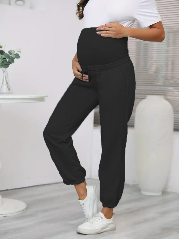 Sandėlyje esančios tarpvalstybinės tiekimos, elastingo juosmens, nėščiosioms skirtos vienspalvės kelnės laisvalaikiui, patogios ir madingos.