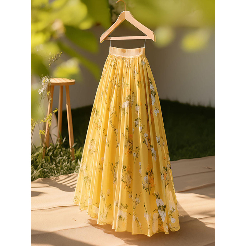 Francia stílusú sikkes és egyedi medálos elegáns sárga mintás szoknya női 2025-ös nyár új, divatos stílus, magas fazon