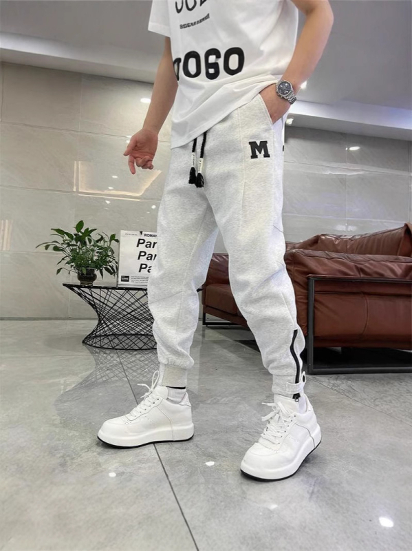 Trendi márka 2025 új férfi egyszínű lezser nadrág koreai stílusú cipzáras melegítőnadrág férfi tavaszi és nyári harlan nadrág