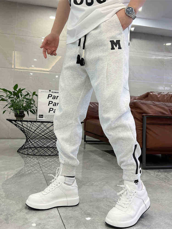 Trendi márka 2025 új férfi egyszínű lezser nadrág koreai stílusú cipzáras melegítőnadrág férfi tavaszi és nyári harlan nadrág