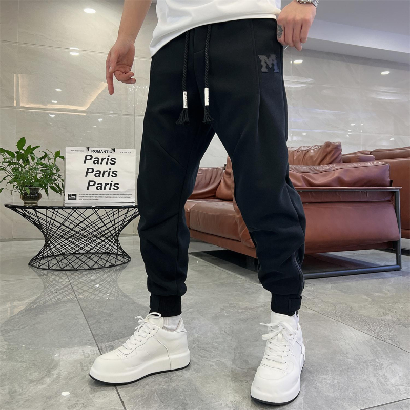 Trendi márka 2025 új férfi egyszínű lezser nadrág koreai stílusú cipzáras melegítőnadrág férfi tavaszi és nyári harlan nadrág