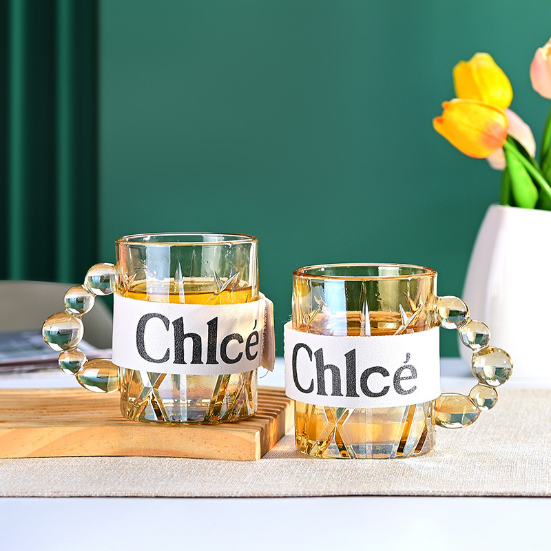 Cana de sticlă cu mâner colorat, îngroșată și rezistentă la temperaturi ridicate, cană de cafea de calitate superioară pentru uz casnic, cană de apă gravată, en-gros din fabrică