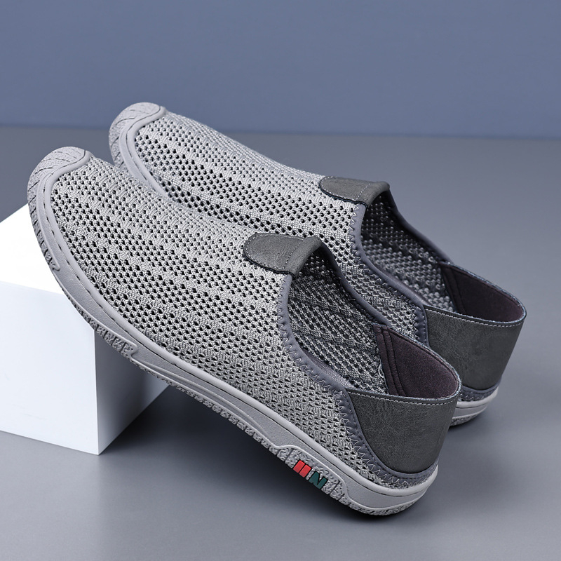 Új férfi cipők tavaszi és nyári alkalmi cipők bebújós hálós, lélegző hálós felületű, repülő szőtt, határokon átnyúló férfi futócipő