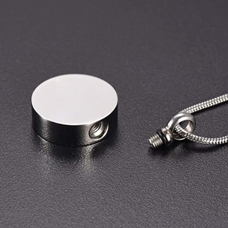 Roostevabast terasest ümmargune mitmevärviline jalajäljega kaelakee, parfüümipudel, lemmikloomade karvade tuhaga mälestusripats