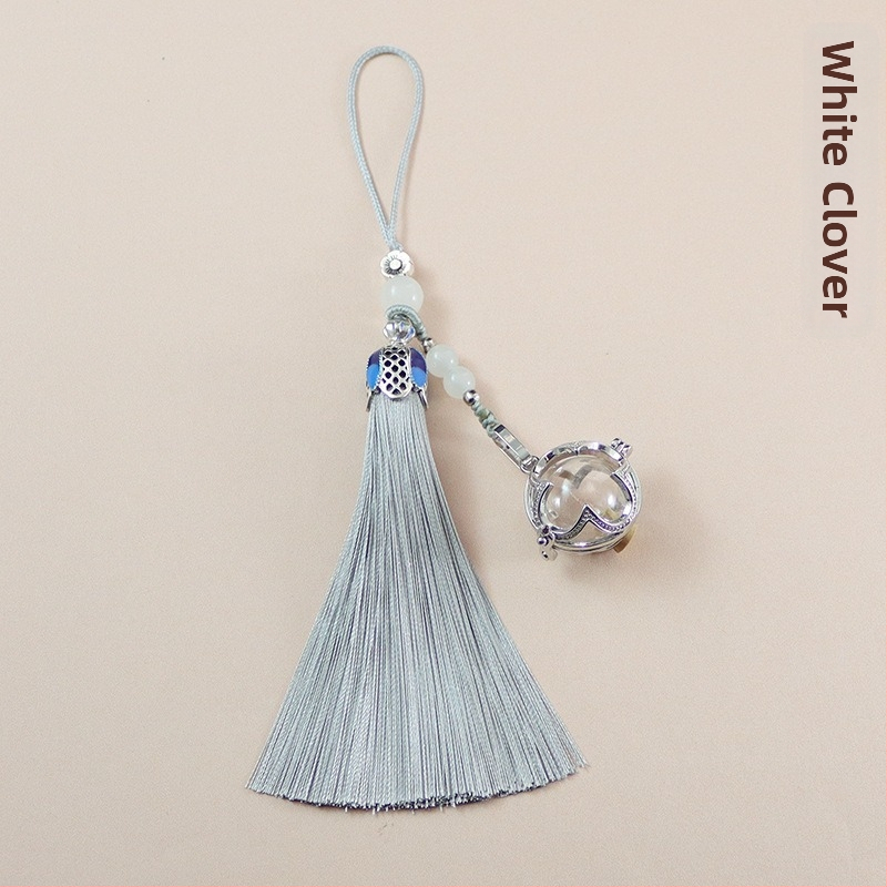 Neljaleheline ristik klaasist kuulikujulise tutiga ripats, mida saab avada, kinaveripudeli ripats, mobiiltelefoni ripats, võtmehoidja ripats, soovipudeli ripats