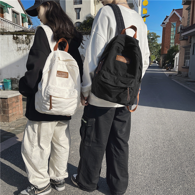 Jaapani stiilis ühevärviline väikese sildiga lõuendikott vabaaja niššiga retro põhikooliõpilastele keskkooliõpilaste klassi kunstikott