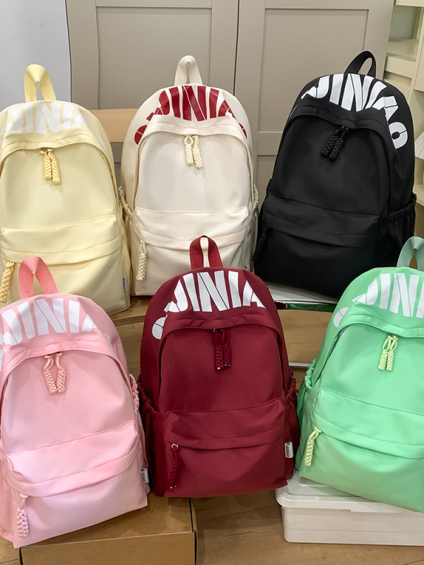 Jaapani stiilis lihtne, kõikvõimalik, suure mahutavusega, ühevärviline koolikott 2025. aasta kevadeks, uus kerge pendelrännakuga õpilase seljakott