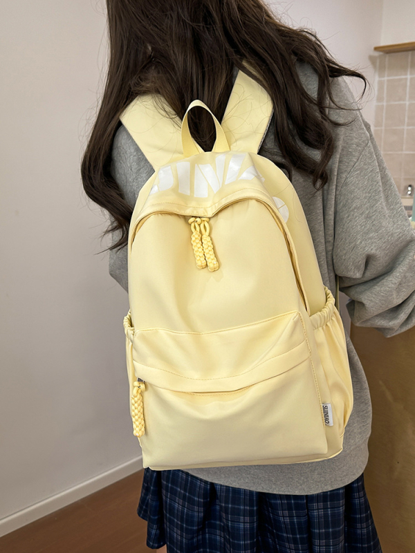 Jaapani stiilis lihtne, kõikvõimalik, suure mahutavusega, ühevärviline koolikott 2025. aasta kevadeks, uus kerge pendelrännakuga õpilase seljakott