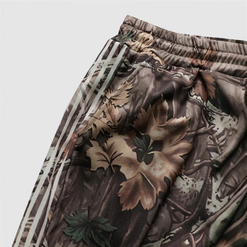 Európai és amerikai határokon átnyúló utcai hip-hop lezser nadrág levelekkel, betűmintás csíkos dizájn széles szárú nadrág laza nadrág