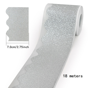 18 m rull sädelevaid kuldseid ja hõbedaseid kleebiseid, läikiva äärisega teadetetahvli kleebiseid, lainelisi dekoratiivkleebiseid