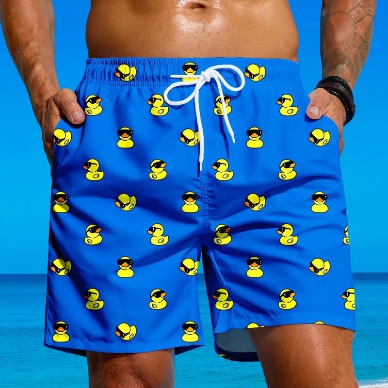 Piiriülesed vabaaja meeste ujumispüksid, Euroopa ja Ameerika stiilis, mugavad, hingavad ja huvitava koomiksiga pardiprindiga rannapüksid rannas surfamiseks