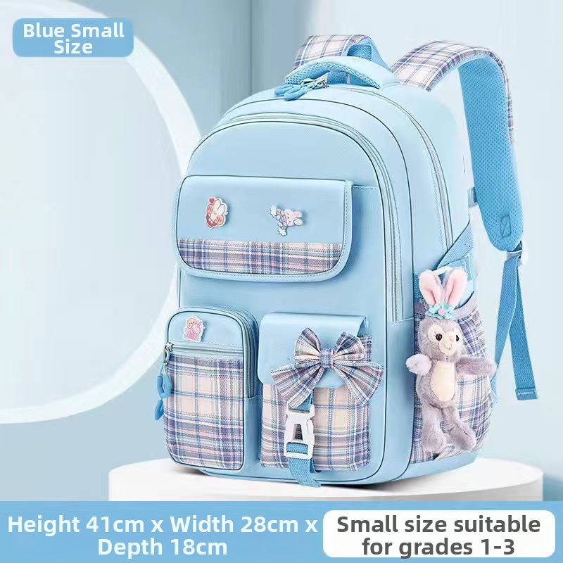 Hulgimüügis olevad algkooliõpilaste koolikotid, naismudelid, armas koomiksiga lips, suure mahutavusega, koormust vähendav seljakott, selgroogu kaitsev laste seljakott