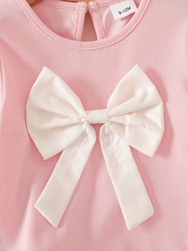 Új, egyszínű rózsaszín masni díszítésű felsők, gyermek farmernadrág, baba kétrészes szett, kislány kosztüm