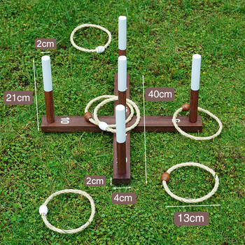 Retro viskemäng kanepiköie rõngas maalähedane rõnga viskamine õues murul meeskonnatöö arendamine pere suhtlemine