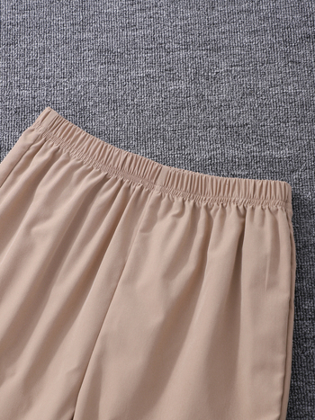 Kaheosaline komplekt keskealistele ja vanematele lastele (tüdrukutele), lapitehnikas pluus + laienevad püksid-ülikond