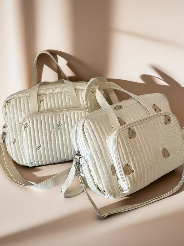 Pietų Korėjoje pristatytas naujas siuvinėto meškiuko mamos krepšys, didelės talpos vystyklų laikymo krepšys, nešiojamas kelioninis krepšys mamai ir kūdikiui.