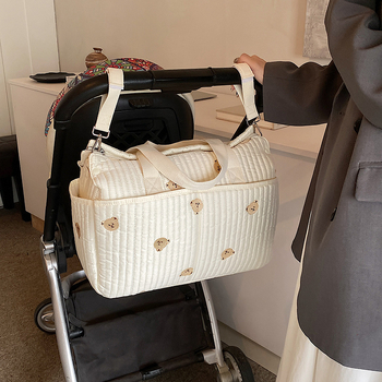 2025 Népszerű, kiváló minőségű, nagy kapacitású anyukatáska, nyomtatott, egyszerű utazókocsi-akasztótáska, többfunkciós tárolótáska