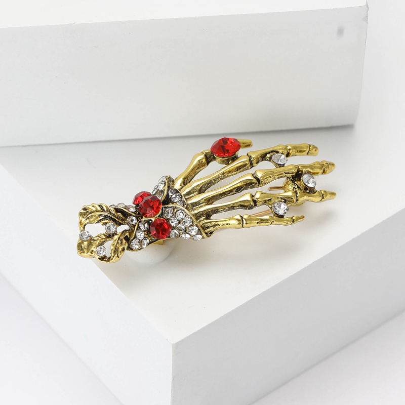 Európai és amerikai retro ötvözet strassz csontváz kéz csont bross személyiség punk stílusú férfi és női ruházati ékszertű