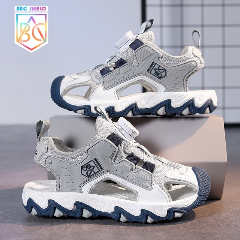 Meiteņu sandales 2025. gada vasarai Zēnu sieta pretslīdes sandales Baotou pludmales apavi ar pogu sprādzi Populāras bērnu sandales