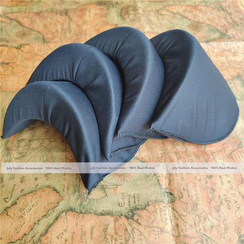 Lavakostüümi ja etenduse täisnurga all olev õlapadi, eriti laiendatud paksendatud õlapadi puuvillasest ülikonnast