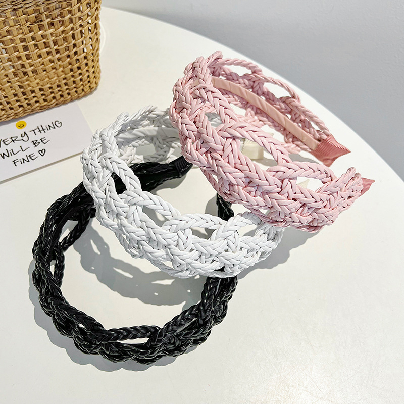 Piiriülene elegantne ühevärviline laia äärega juuksepael, käsitsi valmistatud õõnes nahast kootud keerutatud palmikuga juuksepael, naistele mõeldud tipptasemel juukseaksessuaarid