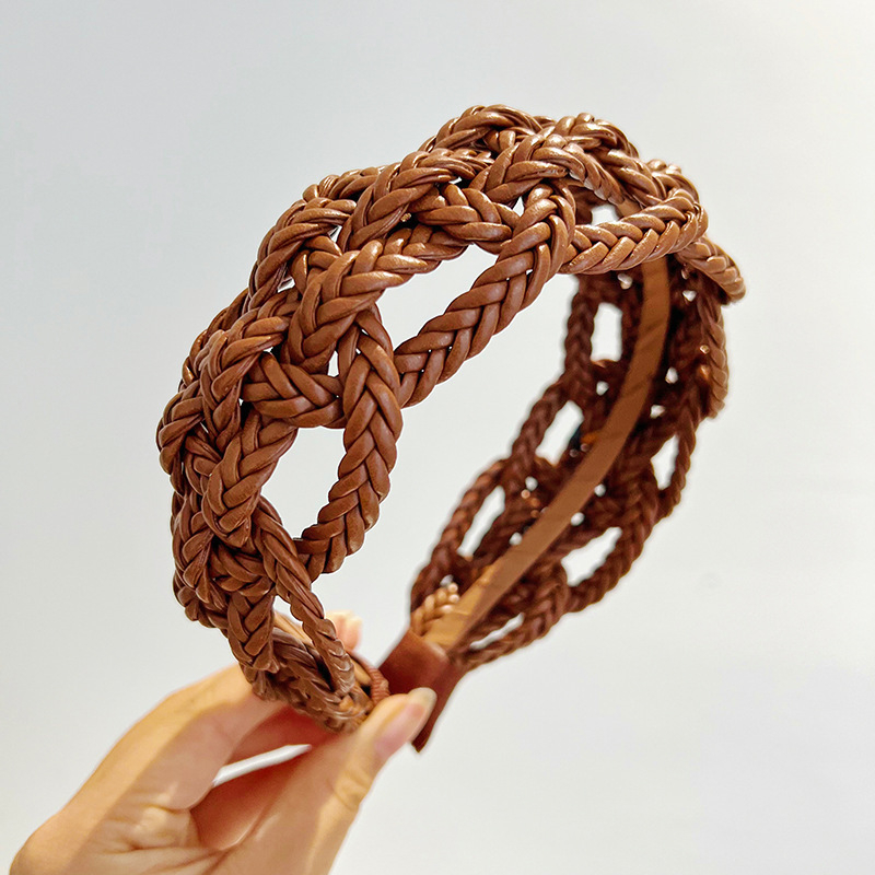 Piiriülene elegantne ühevärviline laia äärega juuksepael, käsitsi valmistatud õõnes nahast kootud keerutatud palmikuga juuksepael, naistele mõeldud tipptasemel juukseaksessuaarid