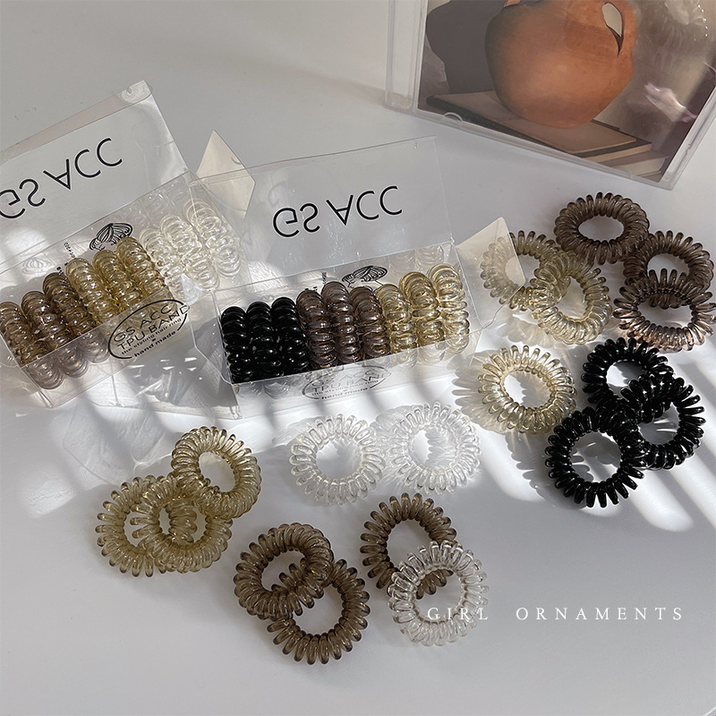 9 vnt. pakuotė ~ palaipsniui keičiami telefono linijos plaukų žiedai dėžutėje paprasti, labai elastingi, permatomi, be pėdsakų galvos apdangalai mergaitėms