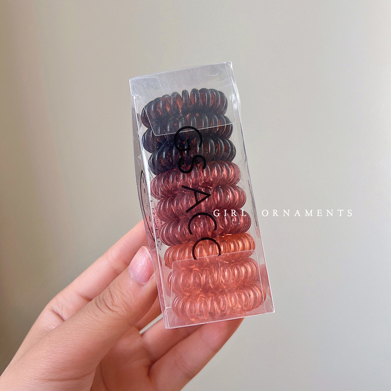 9 vnt. pakuotė ~ palaipsniui keičiami telefono linijos plaukų žiedai dėžutėje paprasti, labai elastingi, permatomi, be pėdsakų galvos apdangalai mergaitėms