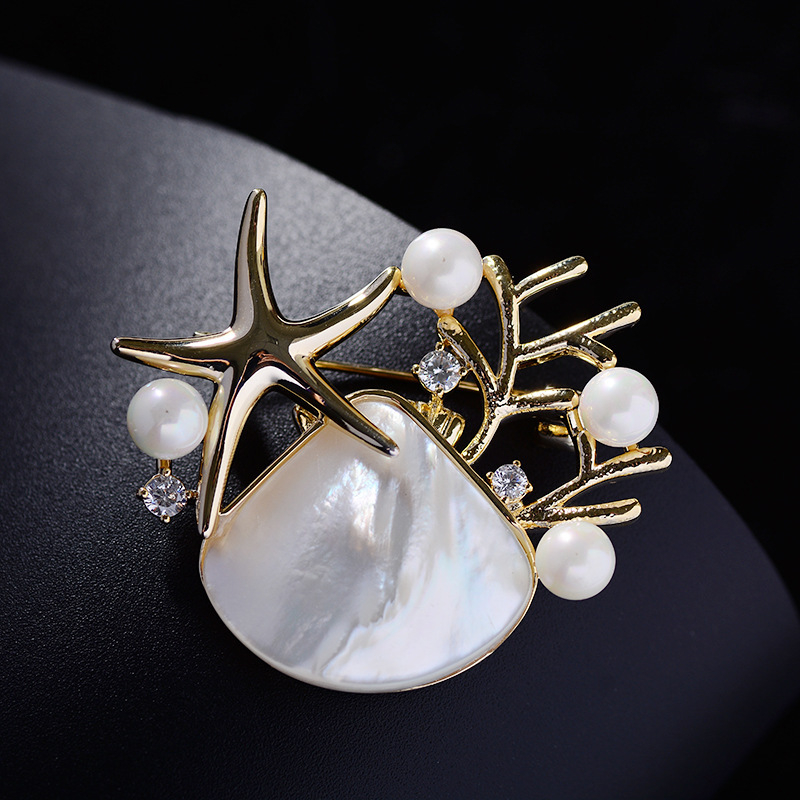 Korėjietiška naujos giliavandenės kriauklės imitacijos sagės versija, madinga kalnų krištolo ir jūros žvaigždės sagė, elegantiški, elegantiški palto aksesuarai, didmeninė prekyba sandėlyje