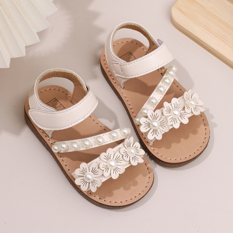 Meiteņu sandales 2025. gada vasaras jaunās ziedu dāmu princeses stila mīkstās zoles modernās saldās princeses kurpes