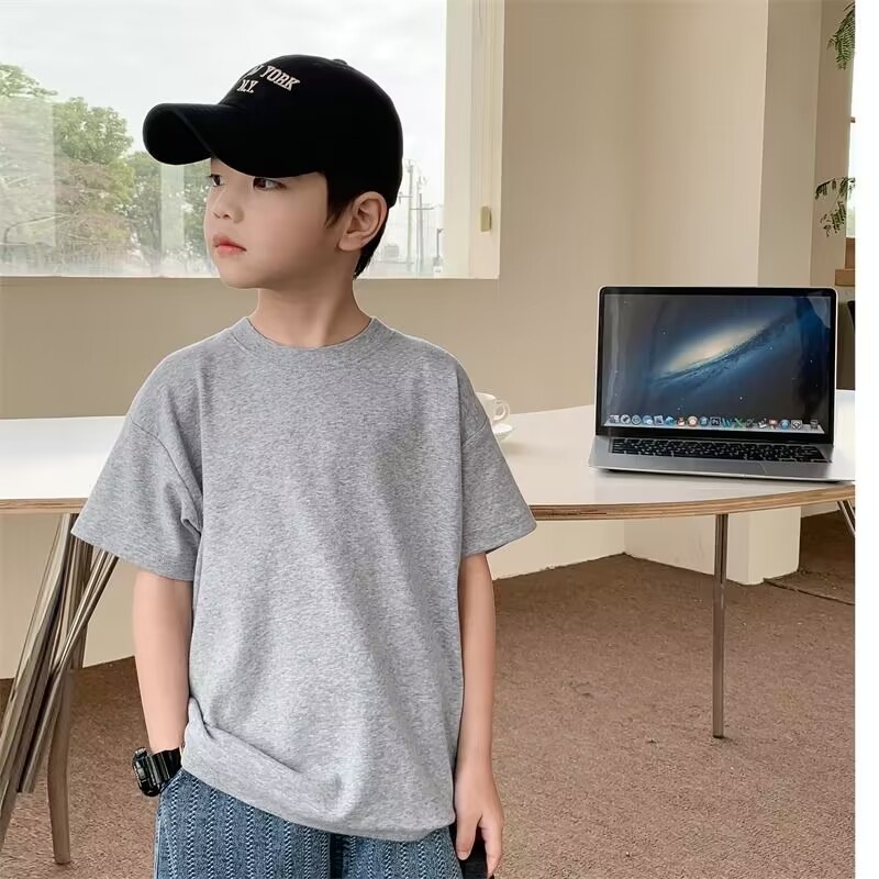 Laste 100% puuvillane lühikeste varrukatega ühevärviline T-särk 2023. aasta suvine uus Korea stiilis lahtine universaalne alumine särk, moodne ülaosaga