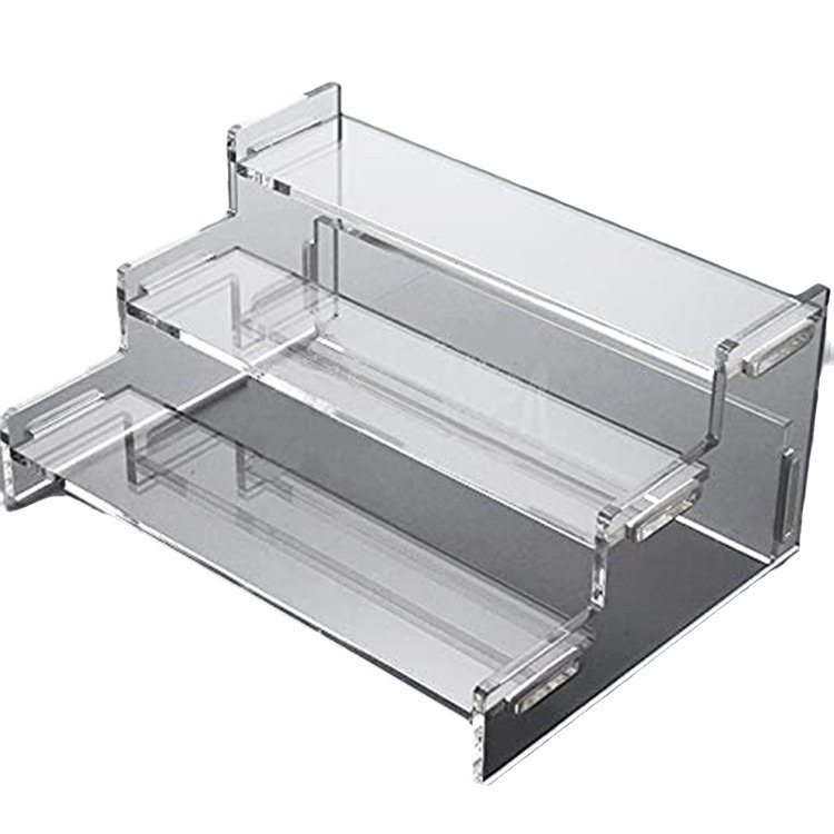 Caurspīdīgs akrila trīsslāņu kāpņu displeja statīvs, aklo kastīšu roku darbs, kēksiņu uzglabāšanas plaukts