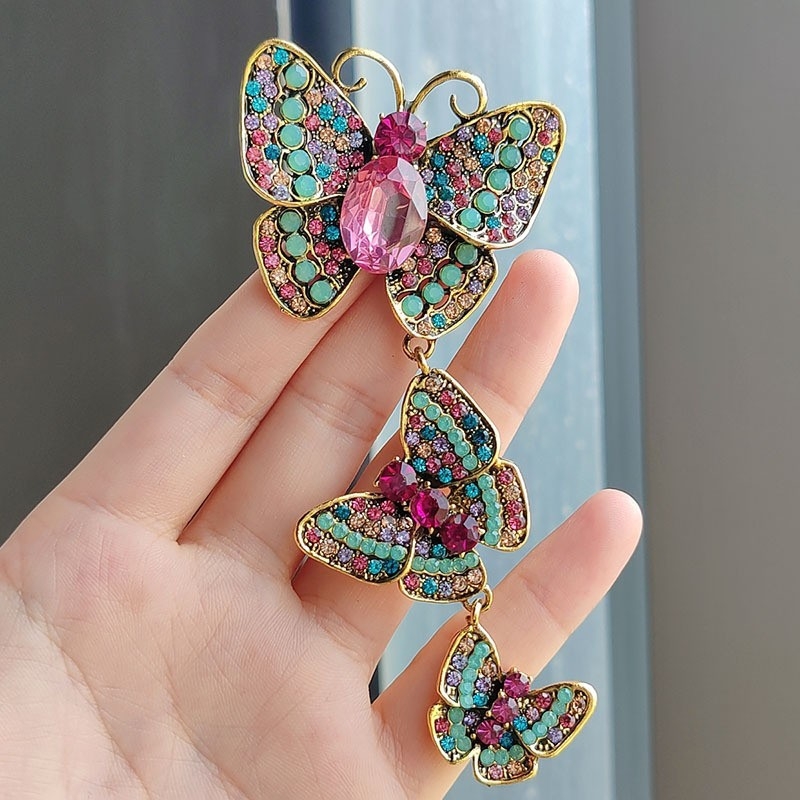 Loominguline pikk liblikpross väikese ülikonnaga rhinestones retro putukanõel elegantne uhke tseremoonia banketisaali korsett