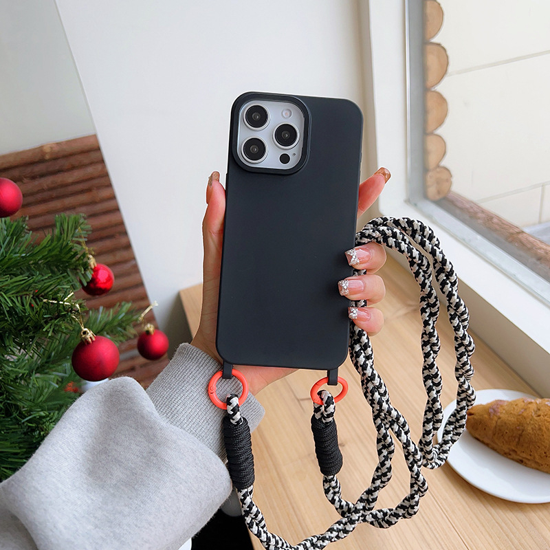 Lihtne ühevärviline telefoniümbris Apple Phone 15pro/14pro kaitseümbrisele koos keerdnööriga risti asetseva kaelarihmaga