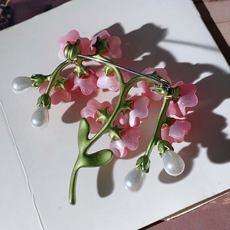 Taimeehted roosa lillega unustamatu pross etnilises stiilis loominguline cheongsam-korsettnõel armastaja kingitus