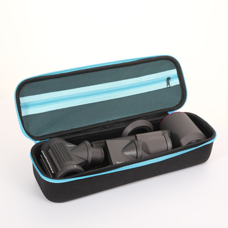 Dysoni fööni hoiukarp, juuksuritööriistade hoiukott, lokitangid, sirgendaja, kukkumisvastane kaitsekott laos.